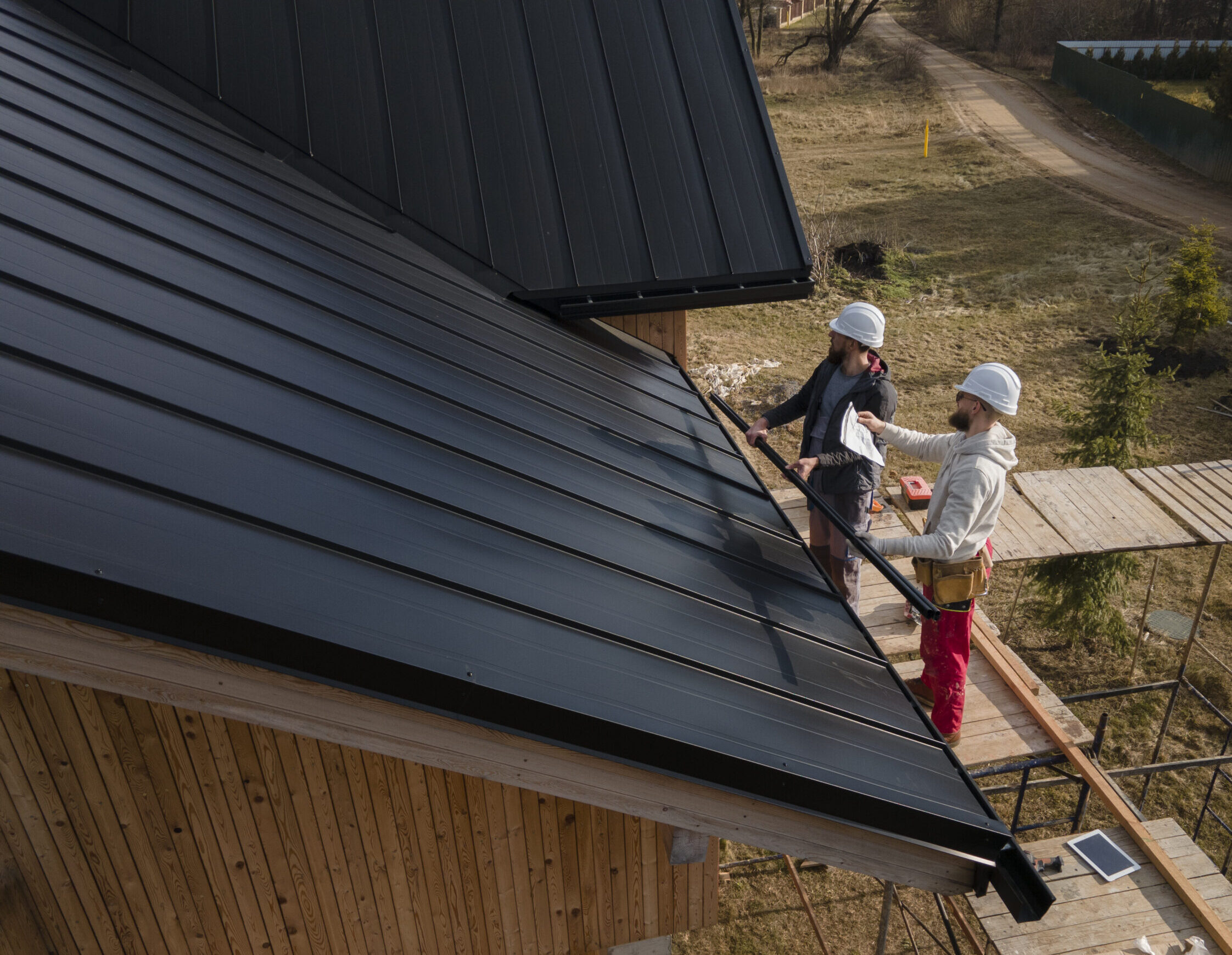 full-shot-roofers-working-with-helmets